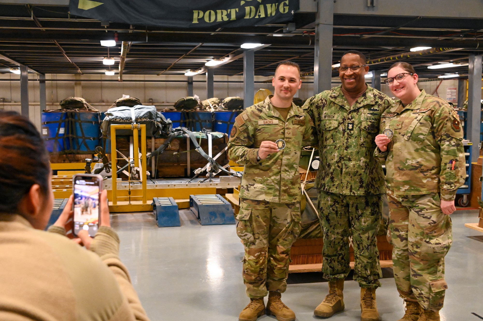 U.S. Navy Fleet Master Chief Donald O. Myrick, U.S. Transportation Command senior enlisted leader, poses for a photo with Airmen from the 97th Logistics Readiness Squadron at Altus Air Force Base, Oklahoma, March 13, 2023. Myrick recognized star performers at every stop while on the tour. (U.S. Air Force photo by Senior Airman Kayla Christenson)