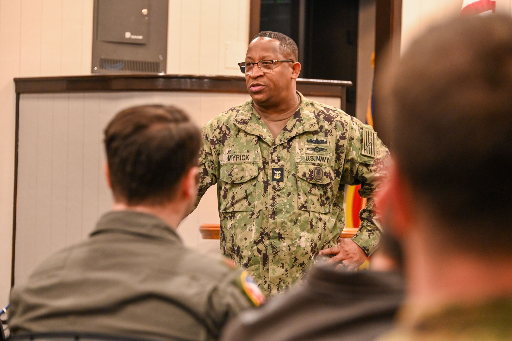 U.S. Navy Fleet Master Chief Donald O. Myrick, U.S. Transportation Command senior enlisted leader, talks with pilots and boom operators after touring the 56th and 54th Air Refueling Squadrons at Altus Air Force Base, Oklahoma, March 15, 2023. Myrick spoke several times to junior Airmen, non-commissioned officers (NCO), senior NCOs and officers.  (U.S. Air Force photo by Senior Airman Kayla Christenson)