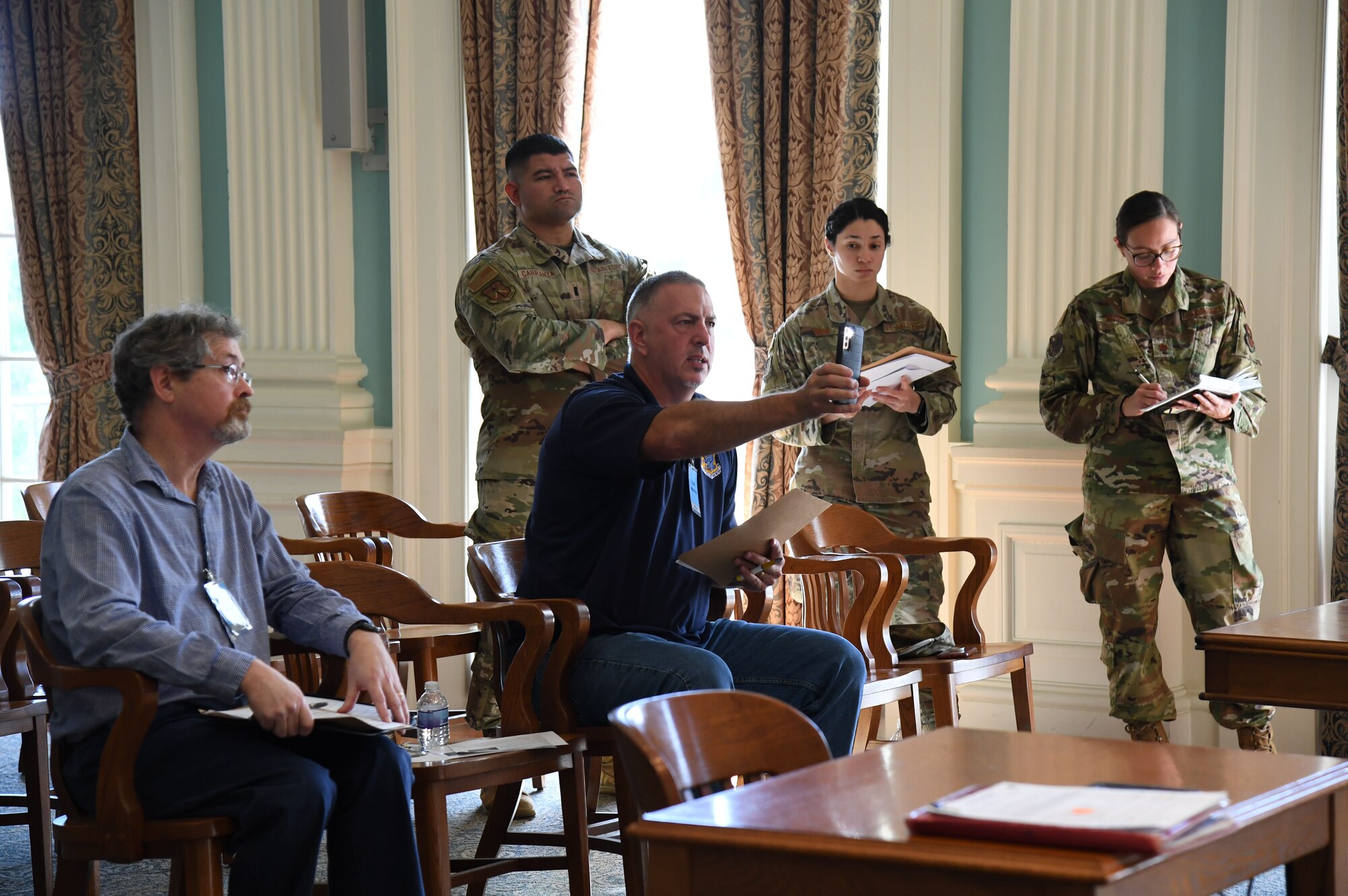 Keesler Air Force Base personnel participate in a press conference inside Biloxi City Hall during the aircraft mishap exercise at Keesler Air Force Base, Mississippi, March 16, 2023.