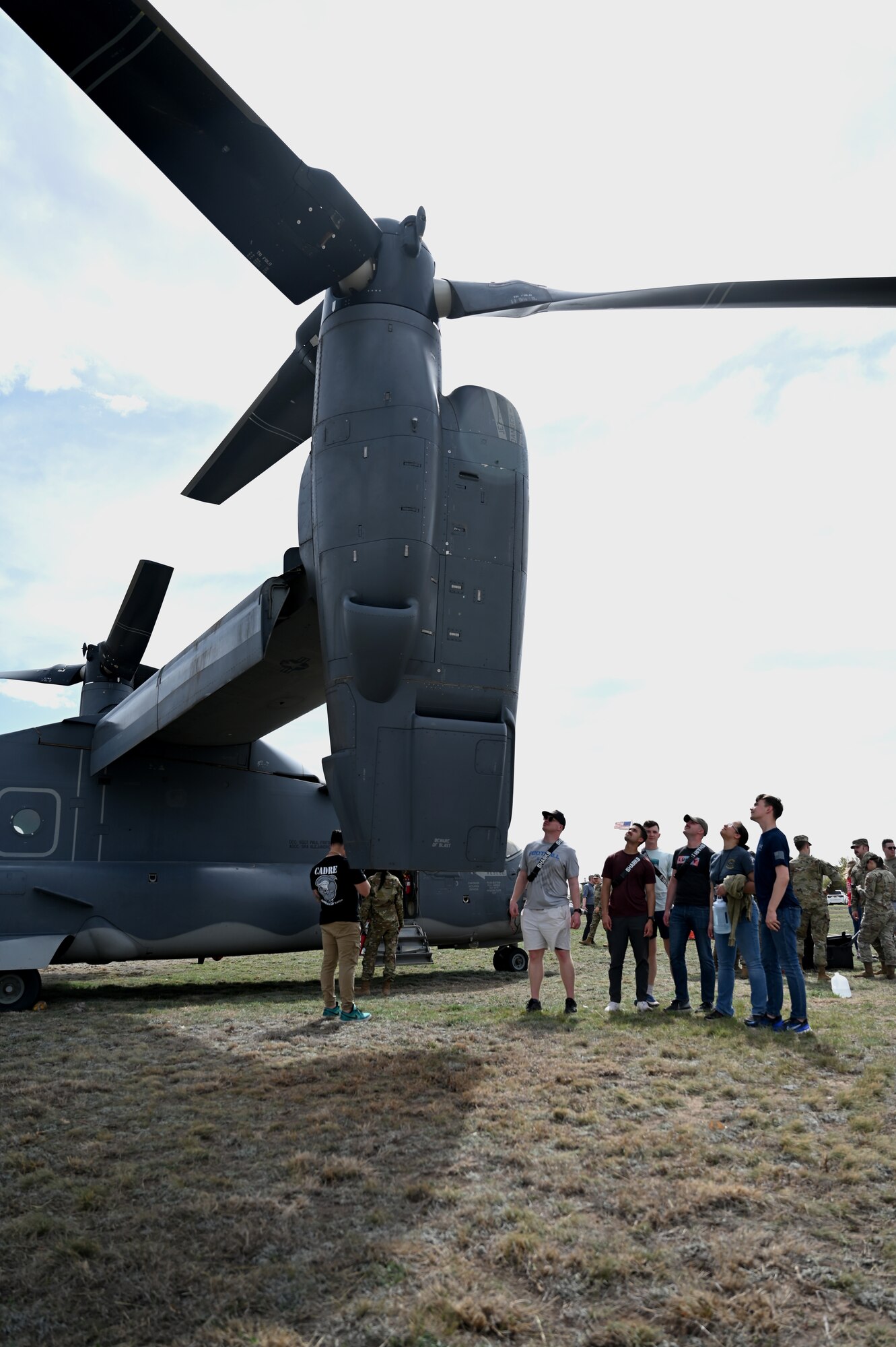 Students assigned to the 316th Training Squadron examine the CV-22 Osprey at Goodfellow Air Force Base, Texas, Mar. 16, 2023. The Osprey flew in from Cannon Air Force Base, N.M., to give 17th Training Wing students the opportunity to have a hands-on demonstration of one of the many airframes they will have the ability to work with once graduating technical training. (U.S. Air Force photo by Airman 1st Class Zachary Heimbuch)