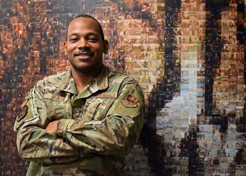 U.S. Air Force Tech. Sgt. Willie Rouse, 17th Training Support Squadron security manager, stands in front of a mural at Goodfellow Air Force Base, Texas, March 15, 2023. Rouse helped members of the 17th Training Group and 17th TRSS as the unit deployment manager. (U.S. Air Force photo by Senior Airman Sarah Williams)