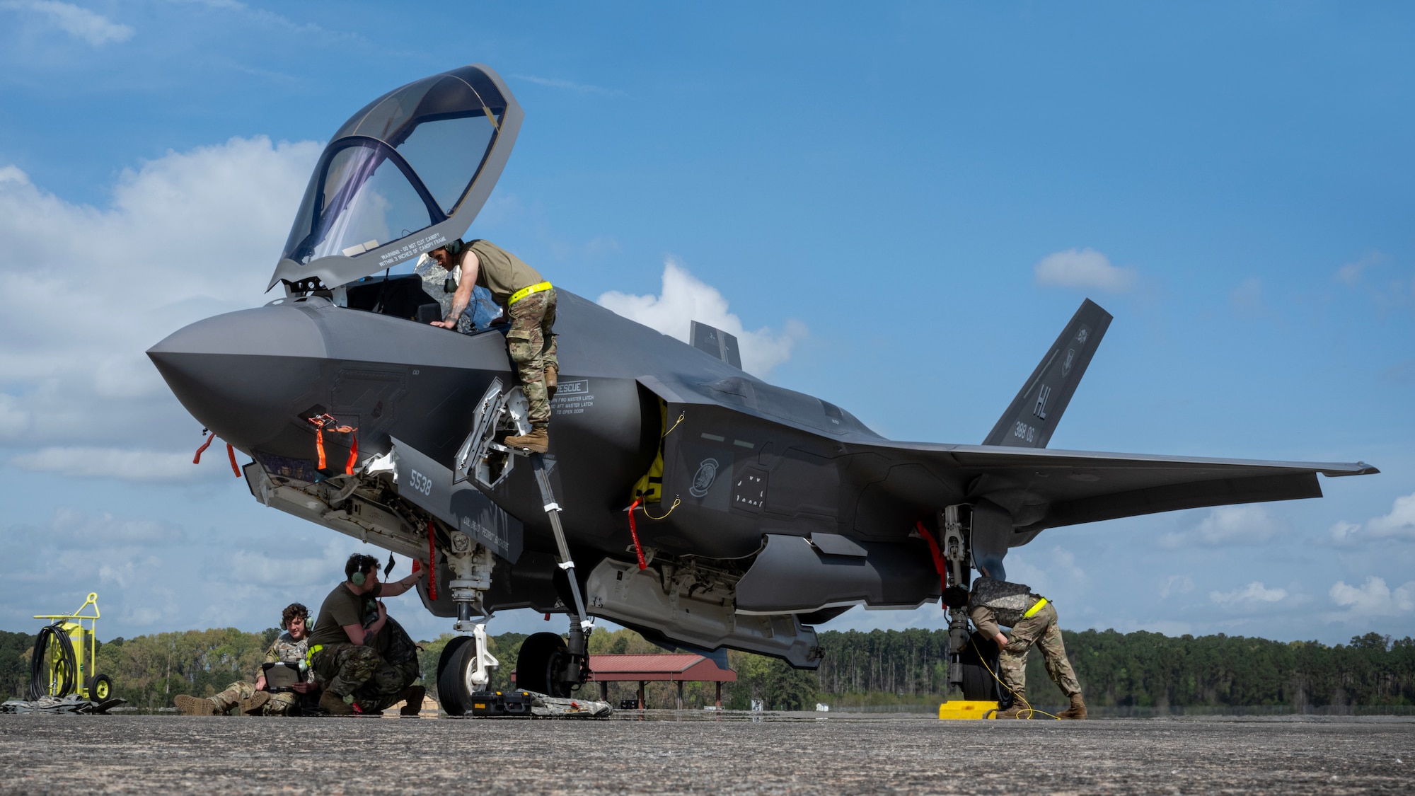 U.S. Air Force maintainers assigned to the 388th Maintenance Group at Hill Air Force Base, Utah, perform a pre-flight maintance check  on a Lockheed F-35 Lightning II aircraft assigned to the 4th Fighter Squadron assigned to Hill AFB, during AGILE FLAG 23-1, March 6, 2023.