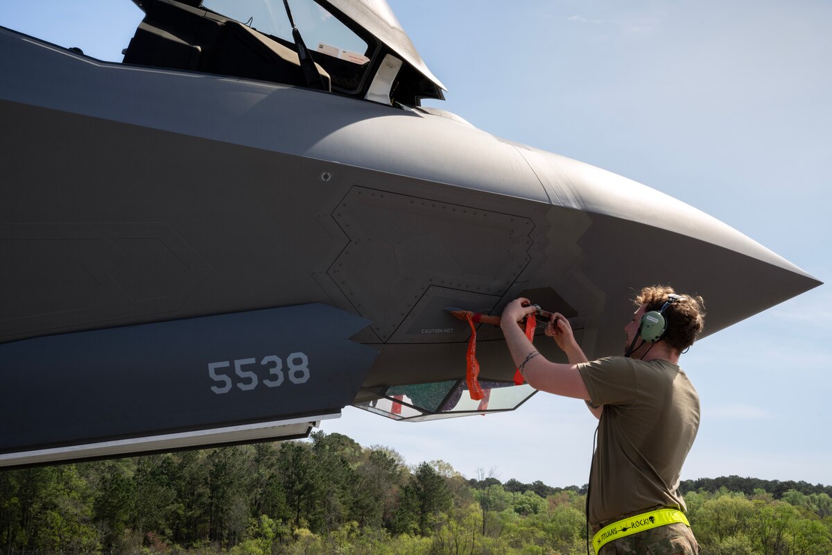 A U.S. Air Force maintainer assigned to the 388th Maintenance Group at Hill Air Force Base, Utah, performs a pre-flight maintance check  on a Lockheed F-35 Lightning II aircraft assigned to the 4th Fighter Squadron assigned to Hill AFB, during AGILE FLAG 23-1, March 6, 2023.