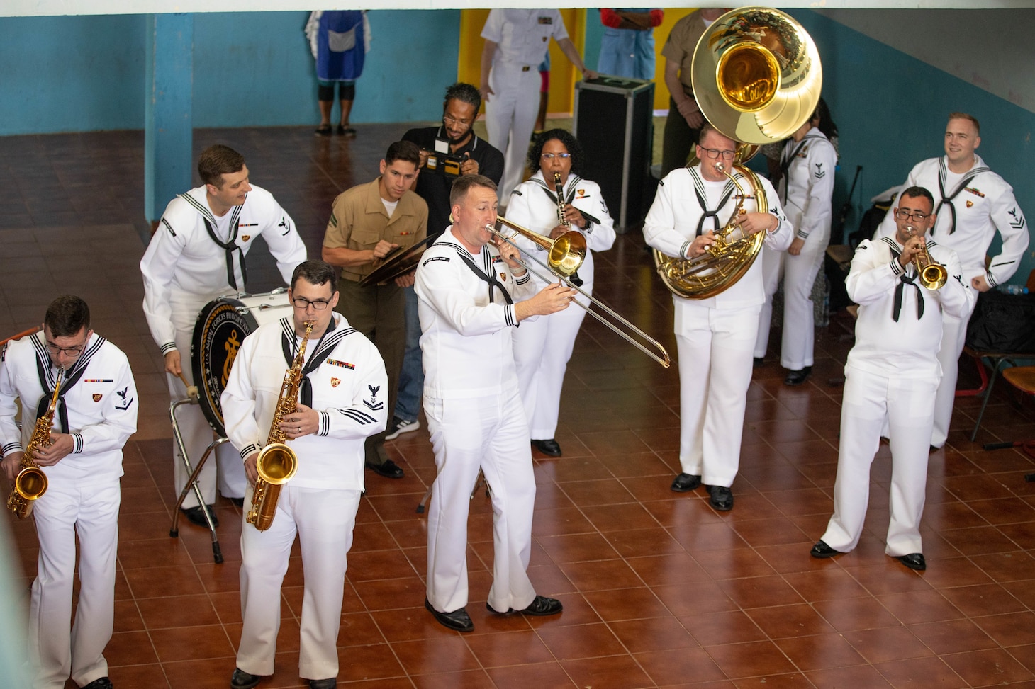 Marines and Sailors perform for students at the Escola Dona Tututa in Sal Island, Cabo Verde, Mar. 18, 2023. Marines and Sailors supporting the African Maritime Forces Summit (AMFS), toured Sal Island and met with local students in a unique opportunity to learn about their culture prior to the opening day of the summit on March 20. Hosted by U.S. Naval Forces Europe and Africa (NAVEUR-NAVAF), the African Maritime Forces Summit (AMFS) is a strategic-level forum that brings African maritime and naval infantry leaders together with their international partners to address transnational maritime security challenges within African waters including the Atlantic Ocean, Indian Ocean, and Mediterranean Sea.