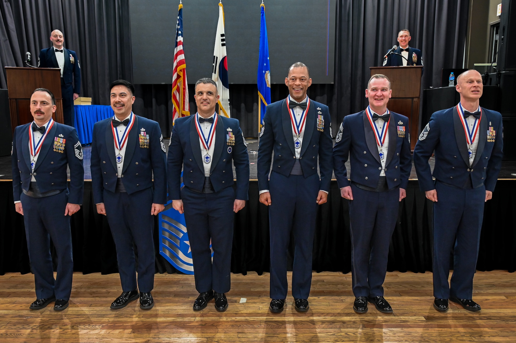 U.S. Air Force chief master sergeant selects sing the Air Force song during a Chief Recognition Ceremony at Osan Air Base, Republic of Korea, March 17, 2023.