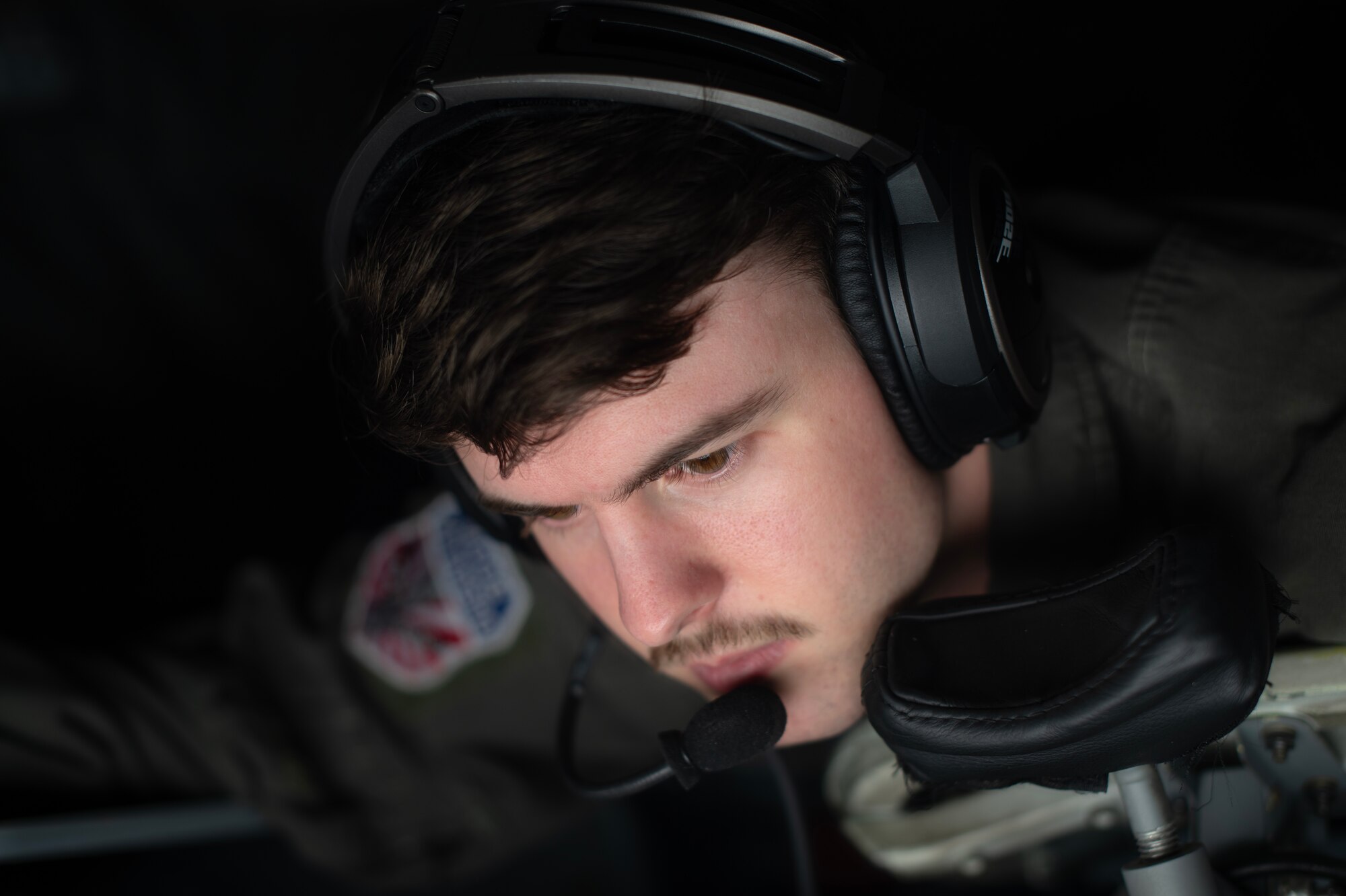 U.S. Air Force Airman 1st Class Zachary Priest, 909th Air Refueling Squadron boom operator, delivers fuel to a 34th Expeditionary Bomb Squadron B-1B Lancer during a flight over the Pacific Ocean, March 19, 2023. Aerial refueling capabilities extend airborne training time and combat radius, ensuring U.S. and Allied nation aircraft are postured to maintain regional peace and stability within the Indo-Pacific area of responsibility. (U.S. Air Force photo by Senior Airman Jessi Roth)
