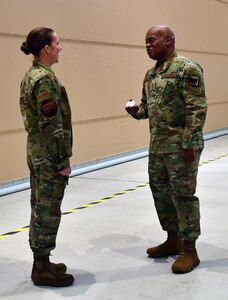 Senior Enlisted Advisor Tony Whitehead, the SEA to the chief of the National Guard Bureau, recognizes an Alaska Air National Guard member during a visit to Joint Base Elmendorf-Richardson, Alaska, Feb. 2, 2023. Whitehead recently participated in a discussion on Black History Month as the National Guard this year celebrates three anniversaries that legally established racial integration in the military, opened up more opportunities for women to serve and ended the draft.