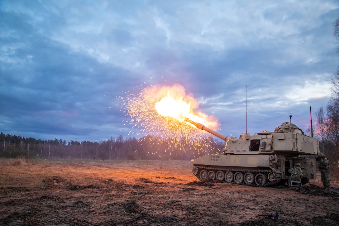 A tank fires upon designated targets.