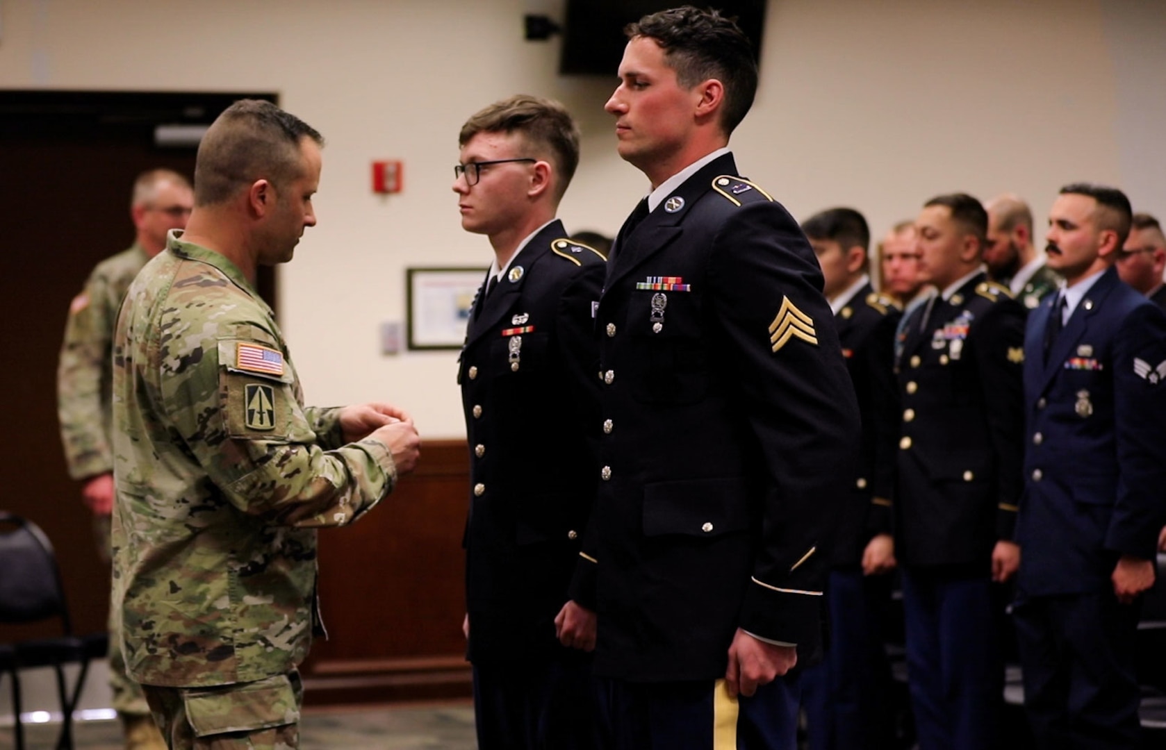 Spc. Samuel Parker, an infantryman with A Company, 2nd Battalion, 151st Infantry Regiment, Sgt. Christopher Swygart, an infantryman with A Company, 1st Battalion, 293rd Infantry Regiment, receive their awards for Best Warrior from Brig. Gen. Justin Mann, Indiana National Guard director of the joint staff, March 19, 2023, at Camp Atterbury, Ind. Parker and Swygert outperformed their peers in physically and mentally challenging tasks that tested their combat readiness.