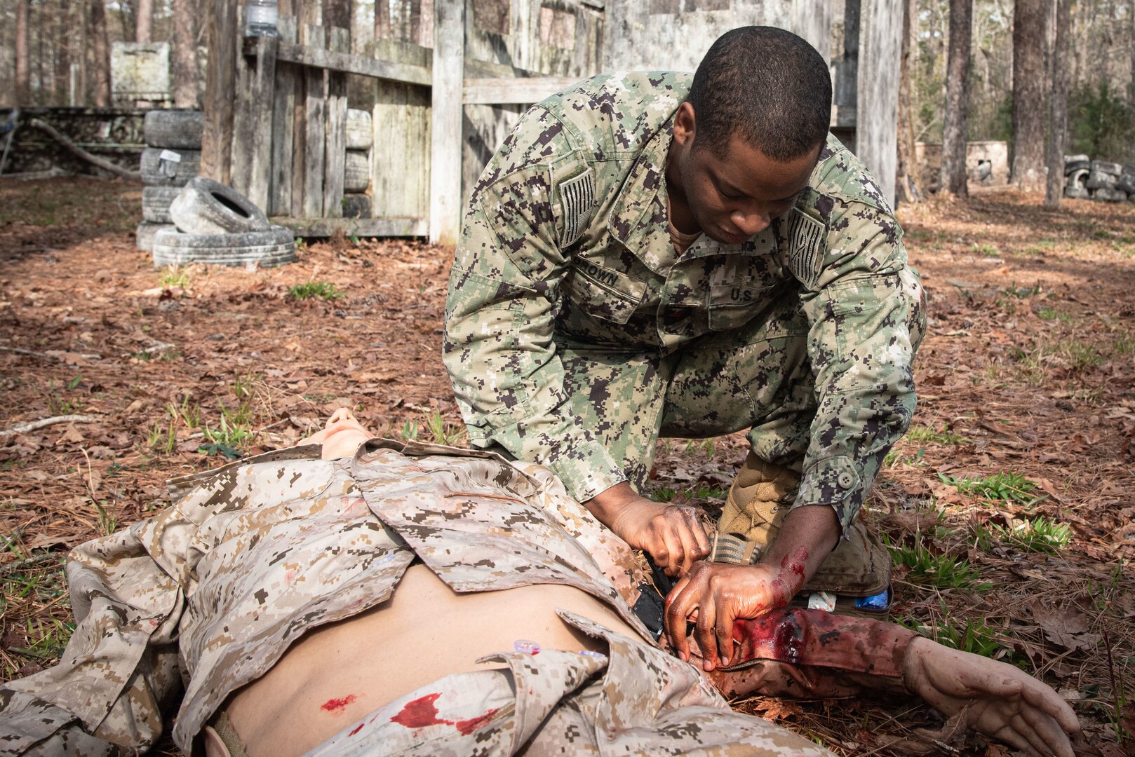 *Training* Hospital Corpsman Second Class Charles Brown applies a tourniquet to a mannequin while conducting Tactical Combat Casualty Care on March 17 aboard Marine Corps Air Station Cherry Point.  The training includes two days of classroom instruction and culminates in a practical exercise involving mannequins equipped to simulate battlefield casualties.