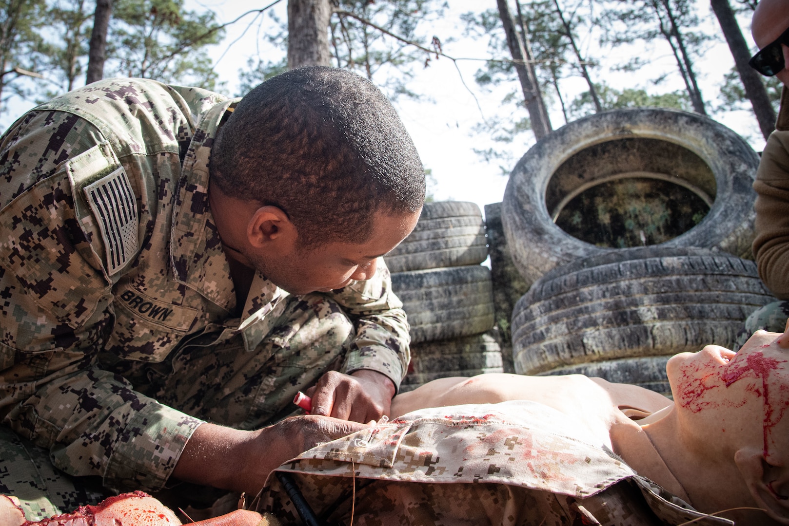 *Training* Hospital Corpsman Second Class Charles Brown treats a mannequin for tension pneumothorax while conducting Tactical Combat Casualty Care on March 17 aboard Marine Corps Air Station Cherry Point.  The training includes two days of classroom instruction and culminates in a practical exercise involving mannequins equipped to simulate battlefield casualties.