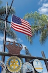 An American flag located at the intersection of Highway 282 and Orange Avenue, which welcomes visitors driving in to the city of Coronado, flies at half-staff. The flag will remain at half-staff through July 25 to honor each service member killed by a gunman in Chattanooga, Tenn. (Navy photo by Yeoman 2nd Class Anthony Ardisone/Released)