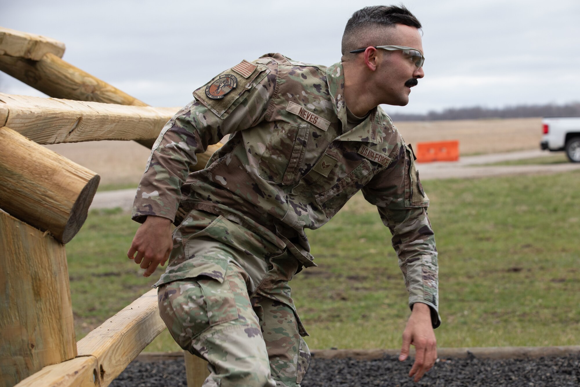 Senior Airman Evan Nieves, with the 122nd Fighter Wing, sprints through the obstacle course during the Best Warrior Competition at Camp Atterbury, Ind., March 17, 2023. Service members from the Indiana National Guard and the Slovakian armed forces tested basic Soldier skills like physical fitness, marksmanship and combat readiness in the three-day competition.