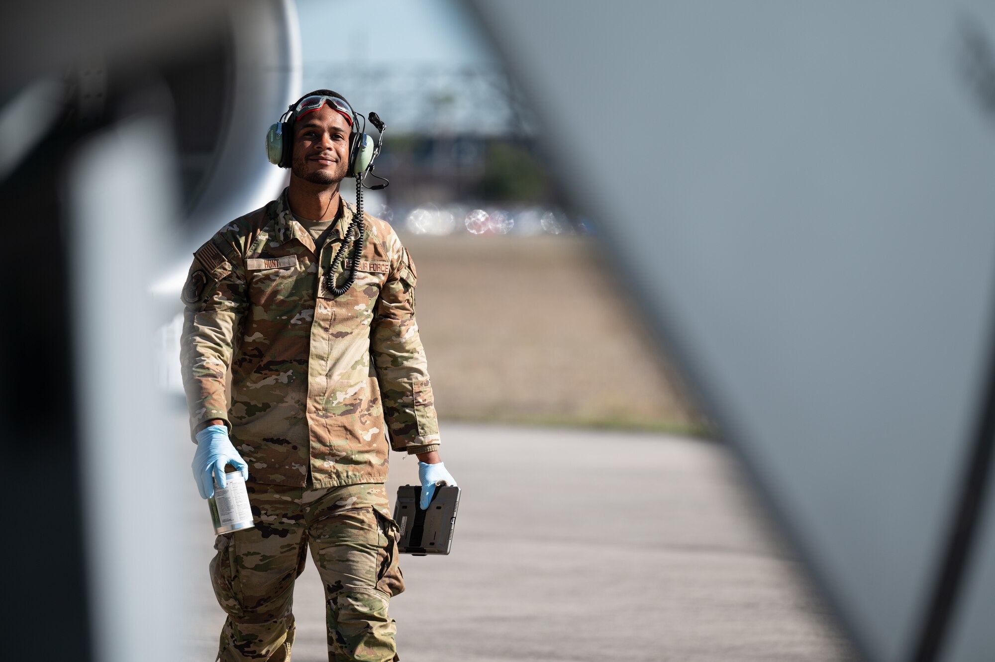 Staff Sgt. Korey Hunt, 927th Aircraft Maintenance Squadron crew chief, walks around a KC-135 Stratotanker aircraft during an exercise at Cecil Airport, Fla., Feb. 7, 2023. Maintainers worked continuously throughout the exercise to ensure the aircraft were prepared for on-going air refueling operations. (U.S. Air Force photo by Tech Sgt. Bradley Tipton)