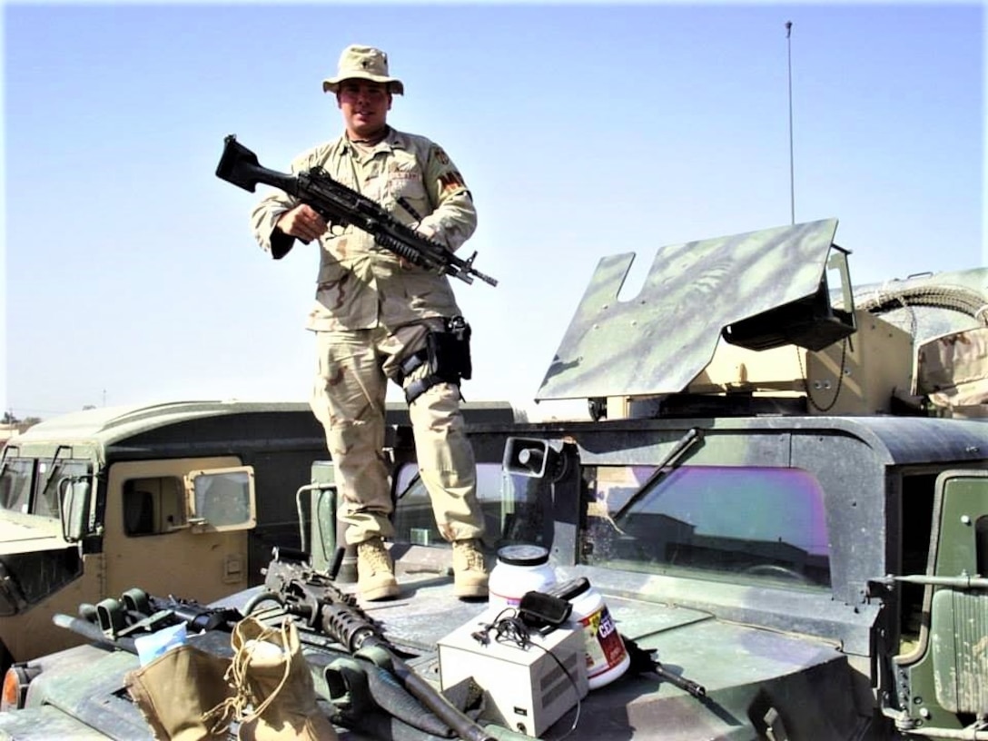 (Left to right) Spc. Jeremy Eades, Sgt. William Baum and Spc. Casey Cooper, all military policemen, 4th Platoon, 617th Military Police Company, 503rd MP Battalion, 18th MP Brigade, provide medical assistance to a wounded insurgent after a group of insurgents attacked a supply convoy March 20, 2005, about 18 miles southeast of Baghdad. The 617th Soldiers successfully defended the convoy and defeated the insurgents, killing 27, wounding six and capturing one. (U.S. Army photo by Sgt. 1st Class Marshall P. Ware)