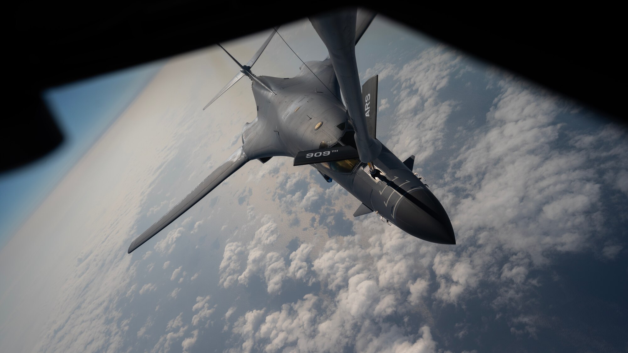 A U.S. Air Force 34th Expeditionary Bomb Squadron B-1B Lancer receives fuel from a 909th Air Refueling Squadron KC-135 Stratotanker during a flight over the Pacific Ocean, March 19, 2023. In order to provide a safe, secure, effective and ready strategic deterrent, U.S. forces must be ready to respond to regional threats. (U.S. Air Force photo by Senior Airman Jessi Roth)