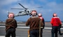 220614-N-YS933-1304 PACIFIC OCEAN (June 14, 2022) Sailors prepare to chock and chain an MH-60S Sea Hawk helicopter, from the “Indians” of Helicopter Sea Combat Squadron (HSC) 6, aboard the aircraft carrier USS Nimitz (CVN 68). Nimitz is underway in the U.S. 3rd Fleet area of operations. (U.S. Navy photo by Mass Communications Specialist 3rd Class Lorenzo Fekieta-Martinez)