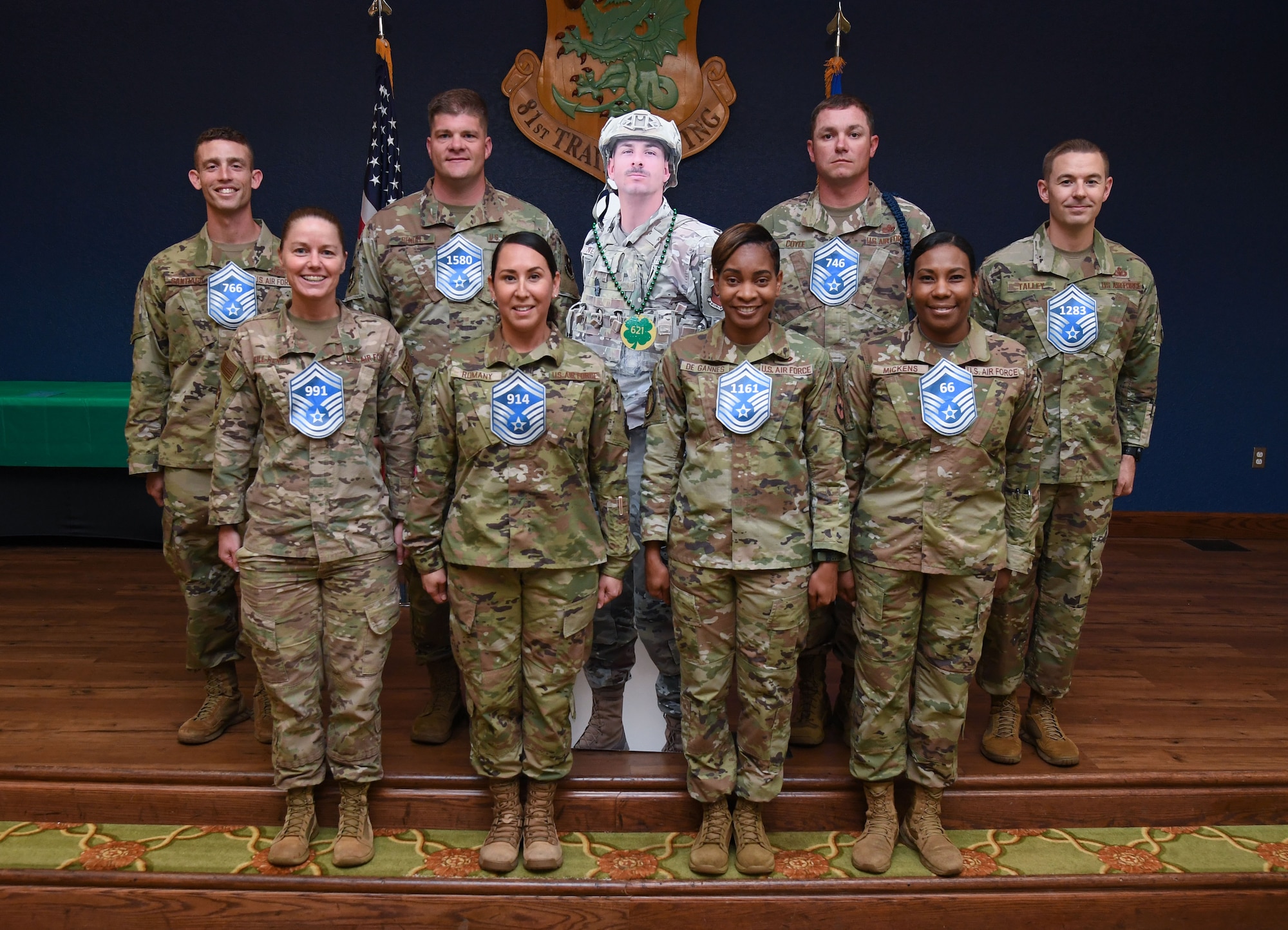 Keesler's newest senior master sergeants pose for a group photo during the Senior Master Sergeant Promotion Release Ceremony inside the Bay Breeze Event Center at Keesler Air Force Base, Mississippi, March 17, 2023.