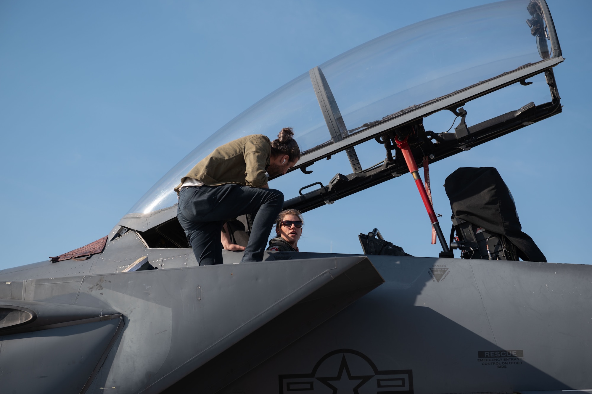 Capt. Kelsey Eastham, weapons system operator 333th Fighter Squadron, and Colt Seman, Arion chief of design, discuss a new in-flight relief system for female pilots at Seymour Johnson Air Force Base, North Carolina, Feb. 15, 2023. (U.S. Air Force photo by Airman 1st Class Rebecca Sirimarco-Lang)