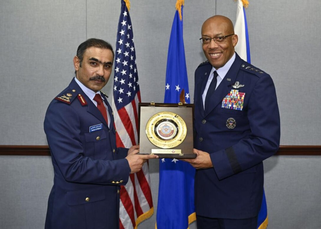 Commander of the Qatar Emiri Air Force Maj. Gen. Jassim Al-Mannai poses with Air Force Chief of Staff Gen. CQ Brown, Jr. during a visit at the Pentagon, Arlington, Va., March 16, 2023. As part of the visit, Al-Mannai received a full-honors arrival, was awarded the Legion of Merit at Joint Base Anacostia-Bolling, Washington, D.C. and attended both an office call with Brown and staff talks at the Pentagon. (U.S. Air Force photo by Eric Dietrich)