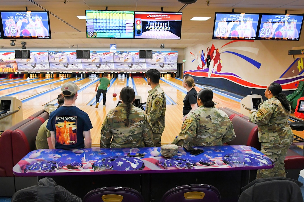 748th Supply Chain Management Group personnel enjoy a fun team building activity by bowling together March 17, 2023, at Hill Air Force Base, Utah. The activity was paid for by the Air Force Unite program, a resiliency-based program that assists leaders in providing opportunities for recreation and cohesive activities for their units. (U.S. Air Force photo by Todd Cromar)