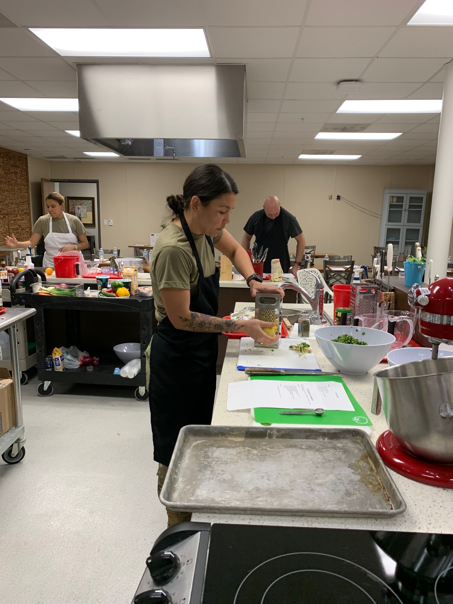 1st Lt. Kenny Carbon preps vegetables for a cauliflower rice tabbouleh. (Courtesy photo)