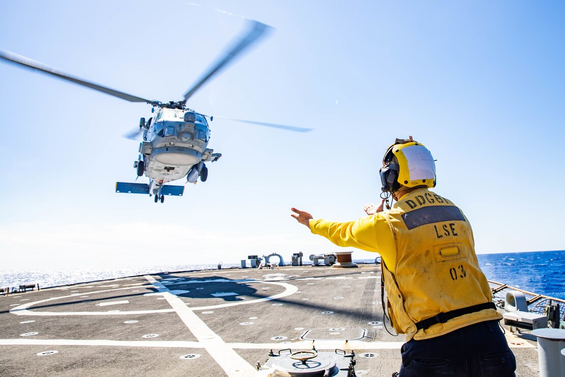 Boatswain’s Mate 3rd Class John Strand, assigned to the Arleigh Burke-class guided-missile destroyer USS Ramage (DDG 61),