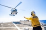 Boatswain’s Mate 3rd Class John Strand, assigned to the Arleigh Burke-class guided-missile destroyer USS Ramage (DDG 61),