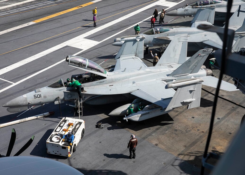 ATLANTIC OCEAN (June 10, 2022) Sailors perform maintenance on an E/A-18G Growler aircraft, attached to Strike Fighter Squadron (VAQ) 140, aboard the aircraft carrier USS George H. W. Bush (CVN 77),