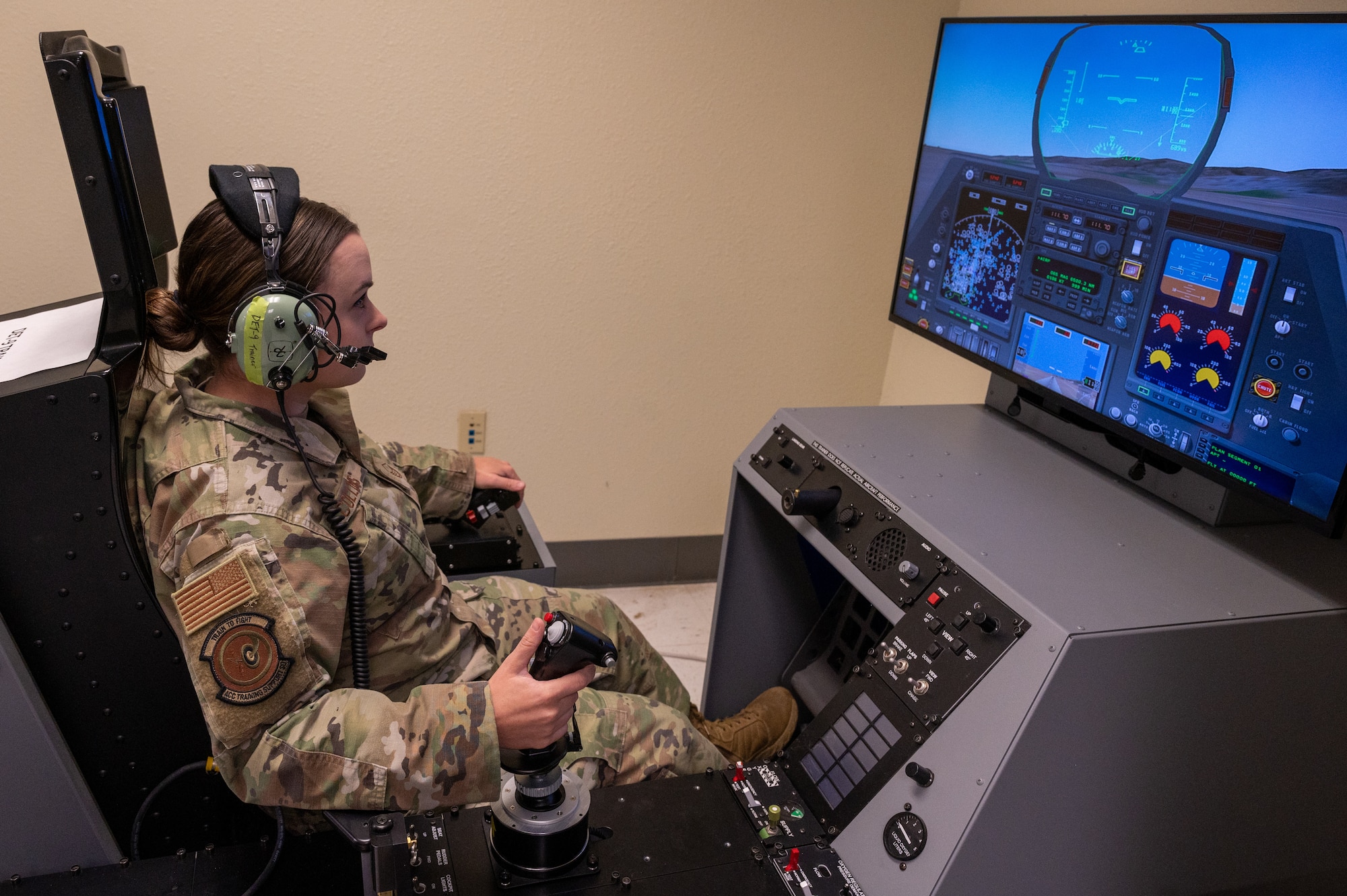 U.S. Air Force Master Sgt. Sarah Collins, Detachment 9 control and reporting center senior enlisted leader, utilizes a hypoxia flight trainer, Mar. 13, 2023, at Luke Air Force Base, Arizona.