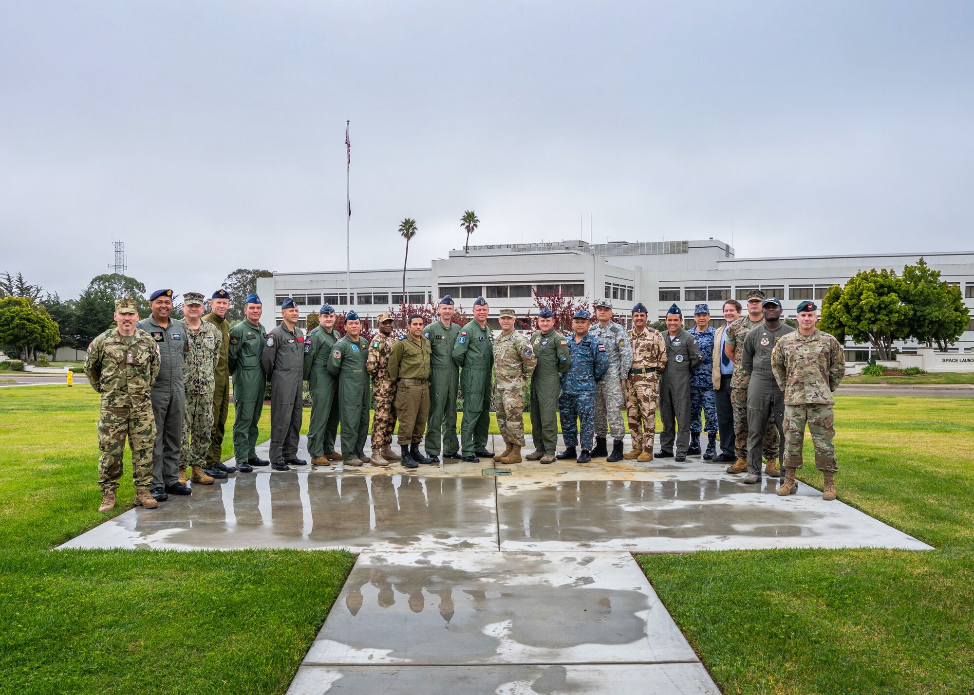 Students from the Air Warfare College (AWC) stand with U.S. Space Force Col. Shay Warakomski, Combined Force Space Component Command deputy commander, middle-right, during their visit to Vandenberg Space Force Base, Calif,
March 13, 2023. Warakomski led a discussion focused on delivering space capabilities in support of Combatant Commanders and Coalition partners to the group consisting of 19 international students and four U.S. students.
The AWC program consists of officers from all U.S. military services, civilians of federal government agencies and officers from the international community, and aims to prepare senior officers to lead at the strategic
level across the range of military operations, in joint, interagency, and multinational environments. (U.S. Space Force photo by Tech. Sgt. Luke Kitterman)