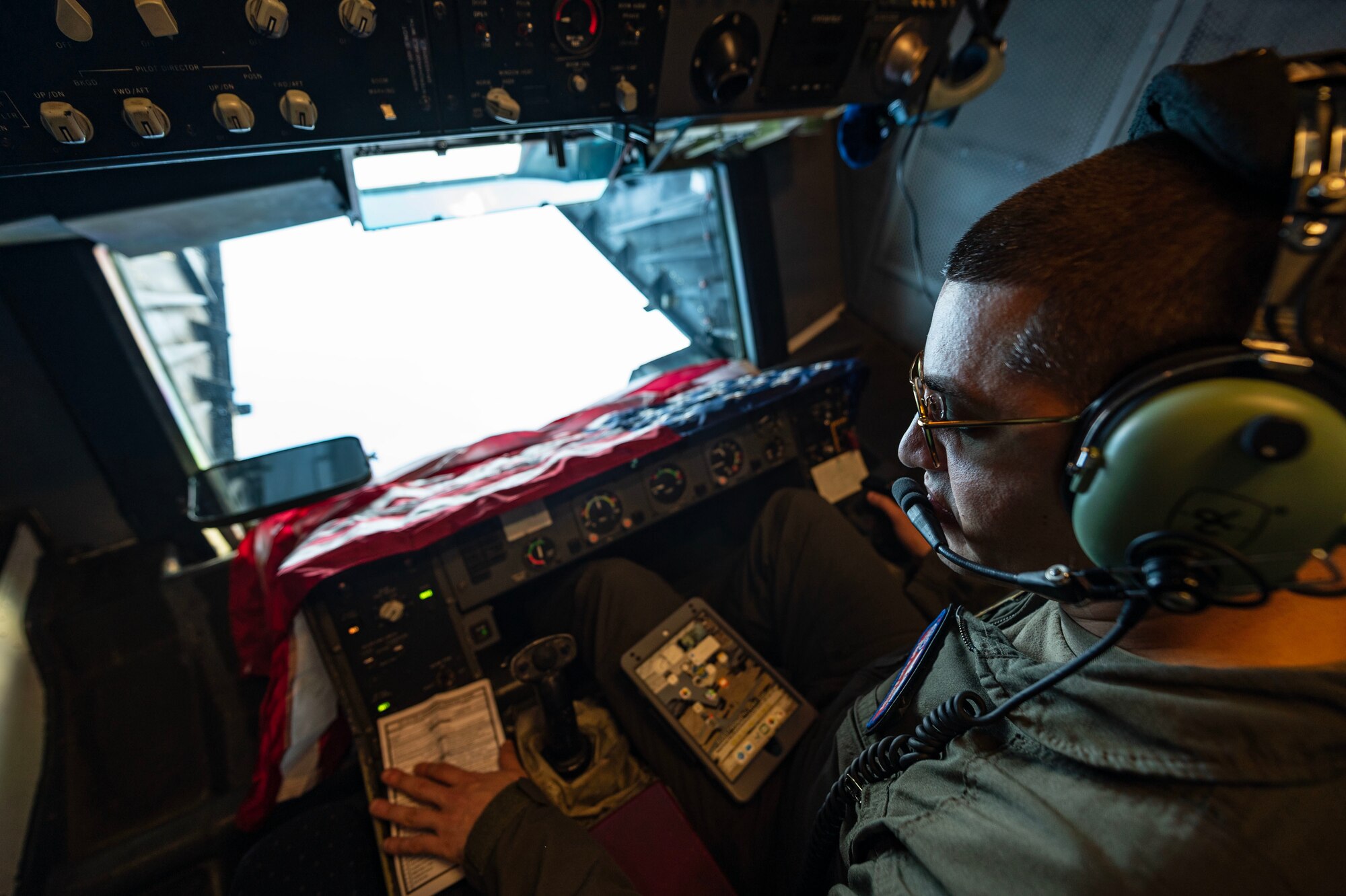 Man waits to refuel a jet