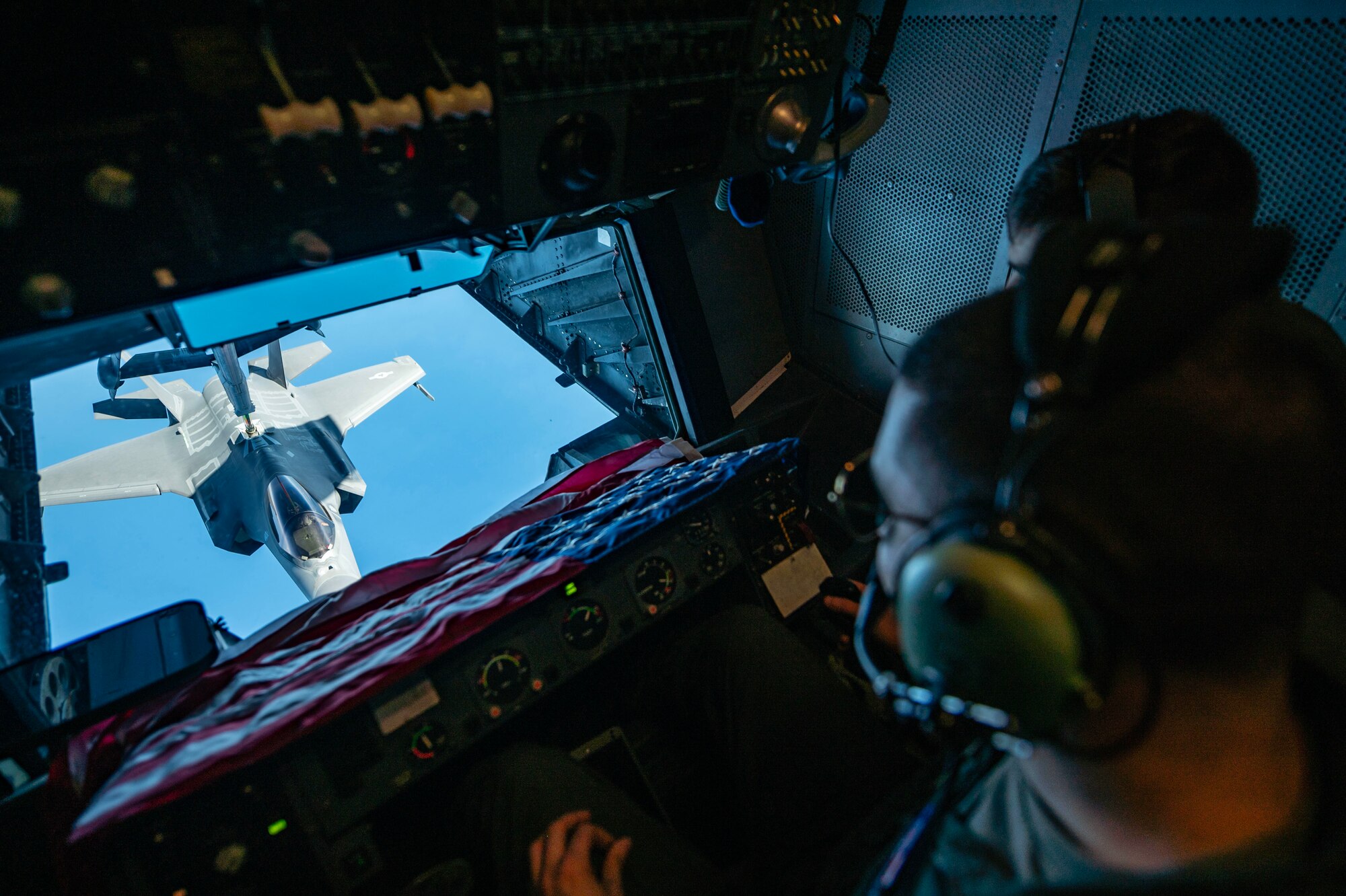 Man refuels jet on airplane