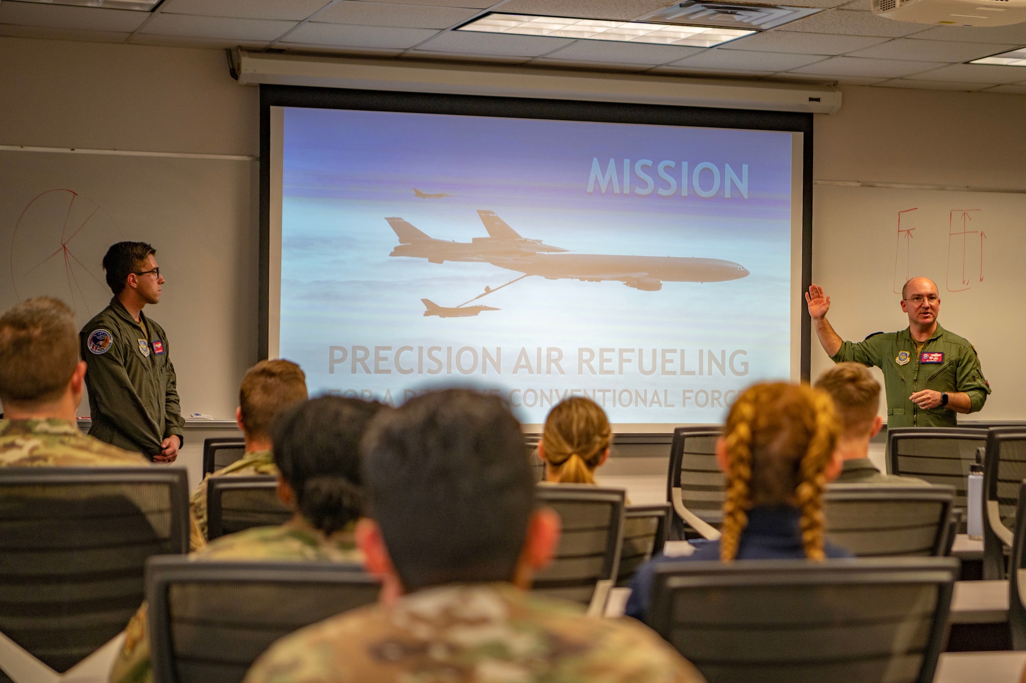 U.S. Air Force Lt. Col. Eli Persons, right, 9th Air Refueling Squadron commander and Embry-Riddle alumni, and 1st Lt. Nathan Amaral, 9th ARS KC-10 Extender pilot, provide insight to Embry-Riddle Aeronautical University Reserve Officer Training Corps detachment 157 cadets at ERAU, Florida, March 2, 2023.