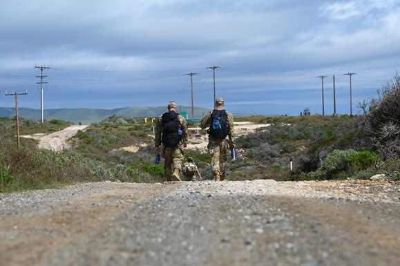 Members of Vandenberg Space Force Base, Calif., participate in a ruck routed around the base March 19, 2023. The death march consisted of either a 26.2 or 14.1 mile ruck in honor of the soldiers who marched for days on end to defend the nation during World War II. (U.S. Space Force photo by Airman 1st Class Kadielle Shaw)