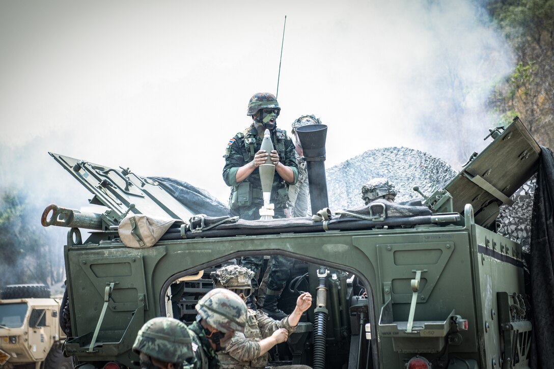 Royal Thai Army Soldiers train alongside U.S. Army Soldiers of 1-2 Stryker Brigade Combat Team, 7th Infantry Division, during a live-fire exercise with a Stryker vehicle-mounted 120mm mortar during Exercise Cobra Gold 2023, near Lop Buri, Kingdom of Thailand, March 3, 2023.