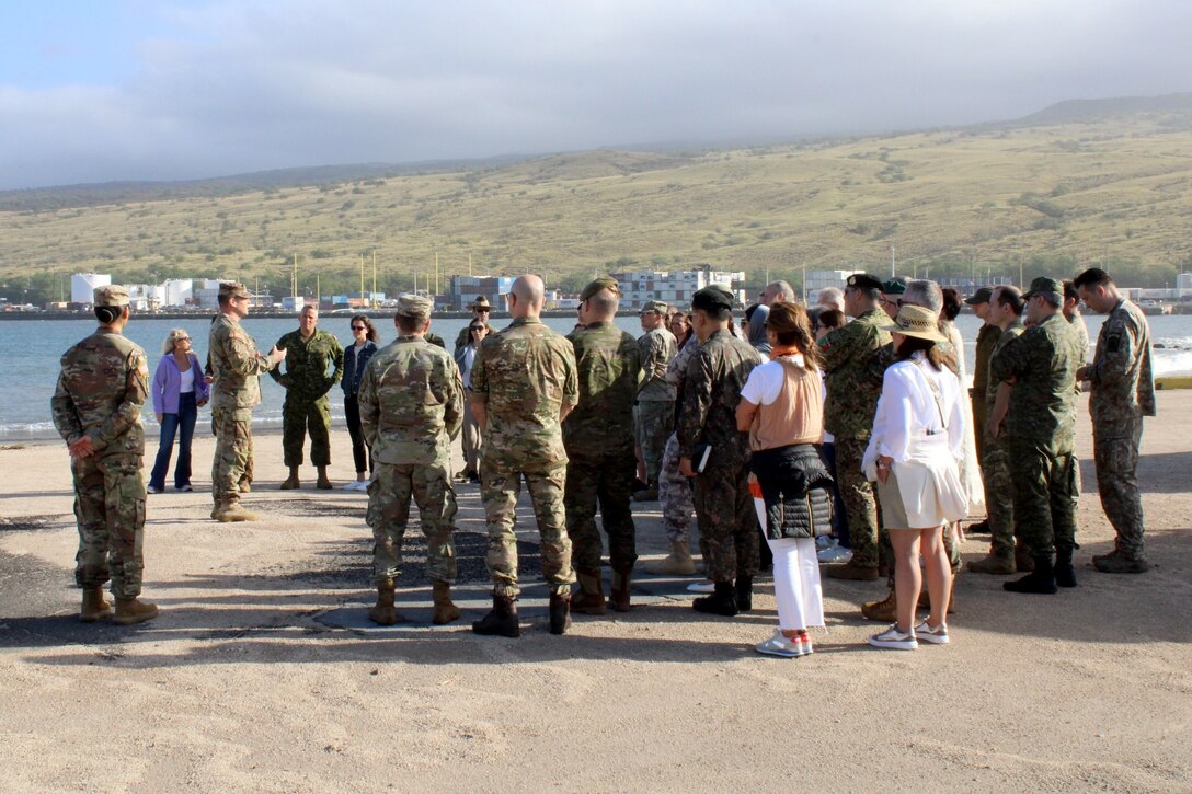 U.S. Army Garrison Pōhakuloa Training Area Garrison (PTA) Commander Lt. Col. Kevin Cronin briefing foreign military attachés and their spouses at Kawaihae Harbor where troops and equipment are shipped from Oahu to conduct training at PTA, March 9, 2023.