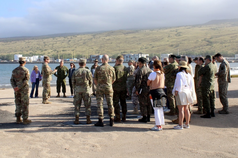 U.S. Army Garrison Pōhakuloa Training Area Garrison (PTA) Commander Lt. Col. Kevin Cronin briefing foreign military attachés and their spouses at Kawaihae Harbor where troops and equipment are shipped from Oahu to conduct training at PTA, March 9, 2023.
