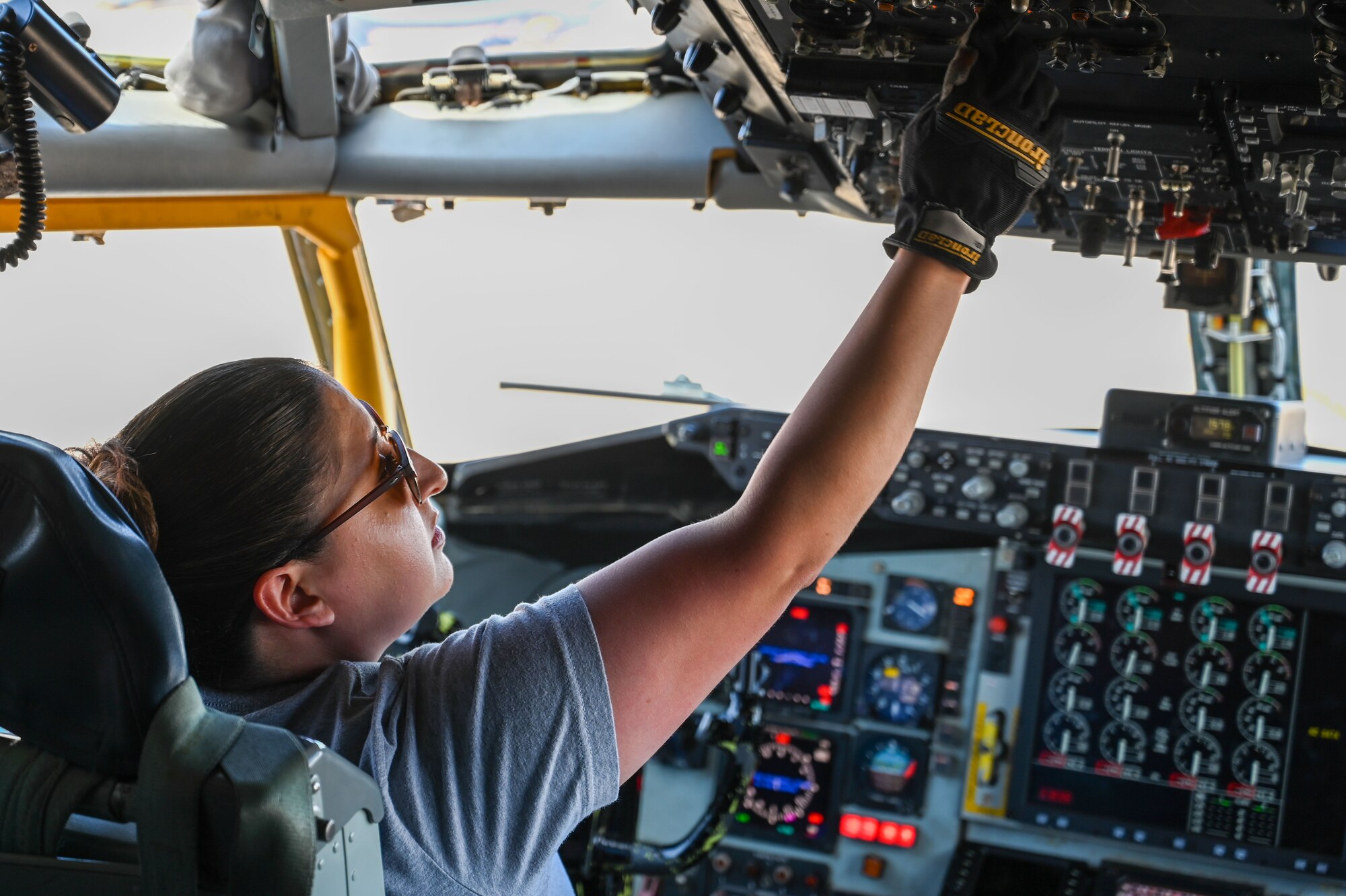 Julianne Martinez, 97th Maintenance Group KC-135 Stratotanker crew chief, ensures the controls in a KC-135 cockpit are properly working at Altus Air Force Base, Oklahoma, March 15, 2023. As a crew chief, Martinez is dedicated to and responsible for all maintenance on one of Altus’ KC-135s. (U.S. Air Force photo by Senior Airman Kayla Christenson)