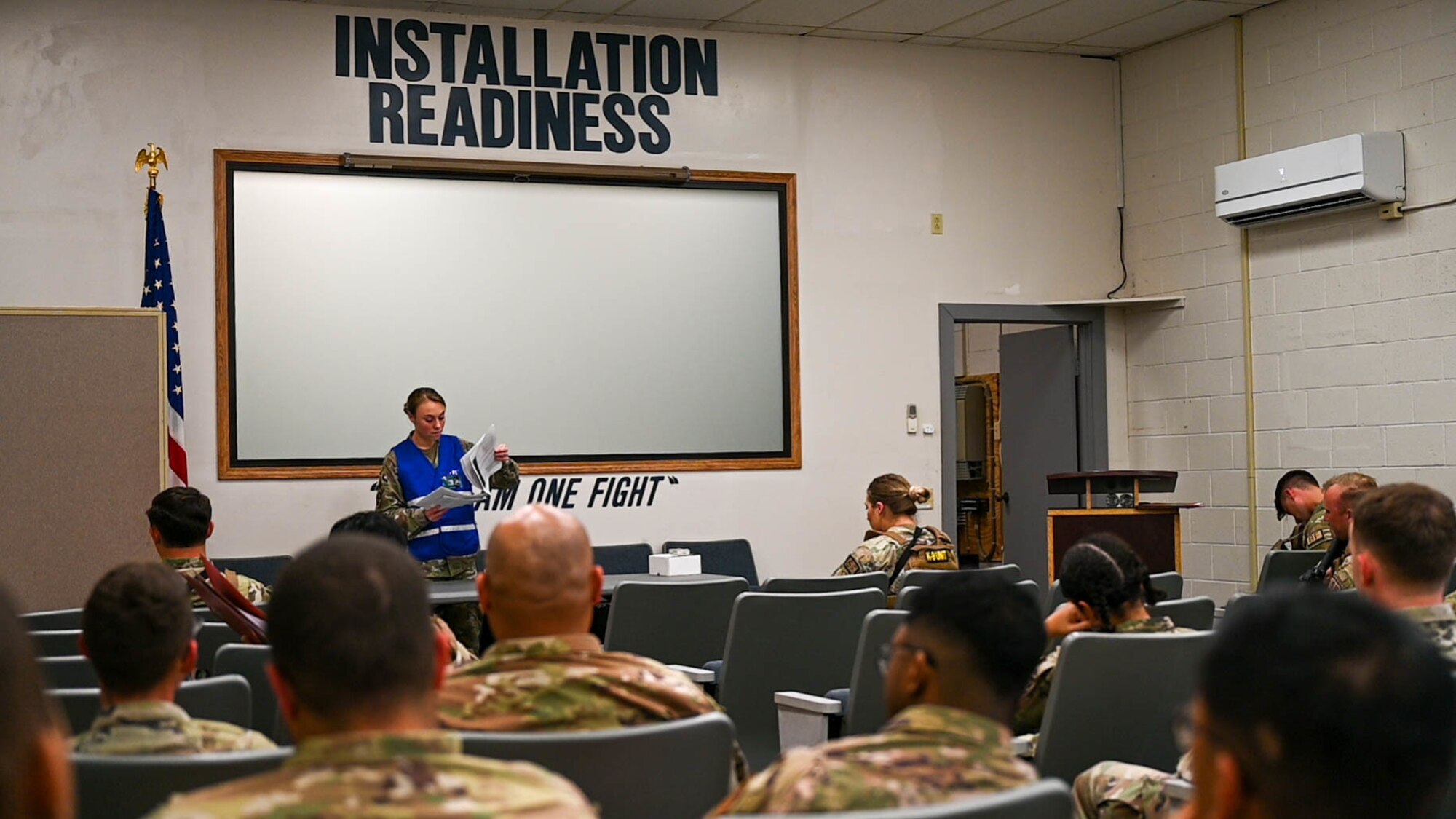 Airmen assigned to the 15th Wing and 647th Air Base Group attend a pre-deployment brief before processing through a pre-deployment function line at Joint Base Pearl Harbor-Hickam, Hawaii, during the Joint Base Readiness Exercise, Feb. 28, 2023.  The 15th Wing trains to operate, fight and advance its capabilities through realistic training exercises designed to test and develop joint logistics, resilience and rapid strategic mobility.  (U.S. Air Force photo by Senior Airman Makensie Cooper)