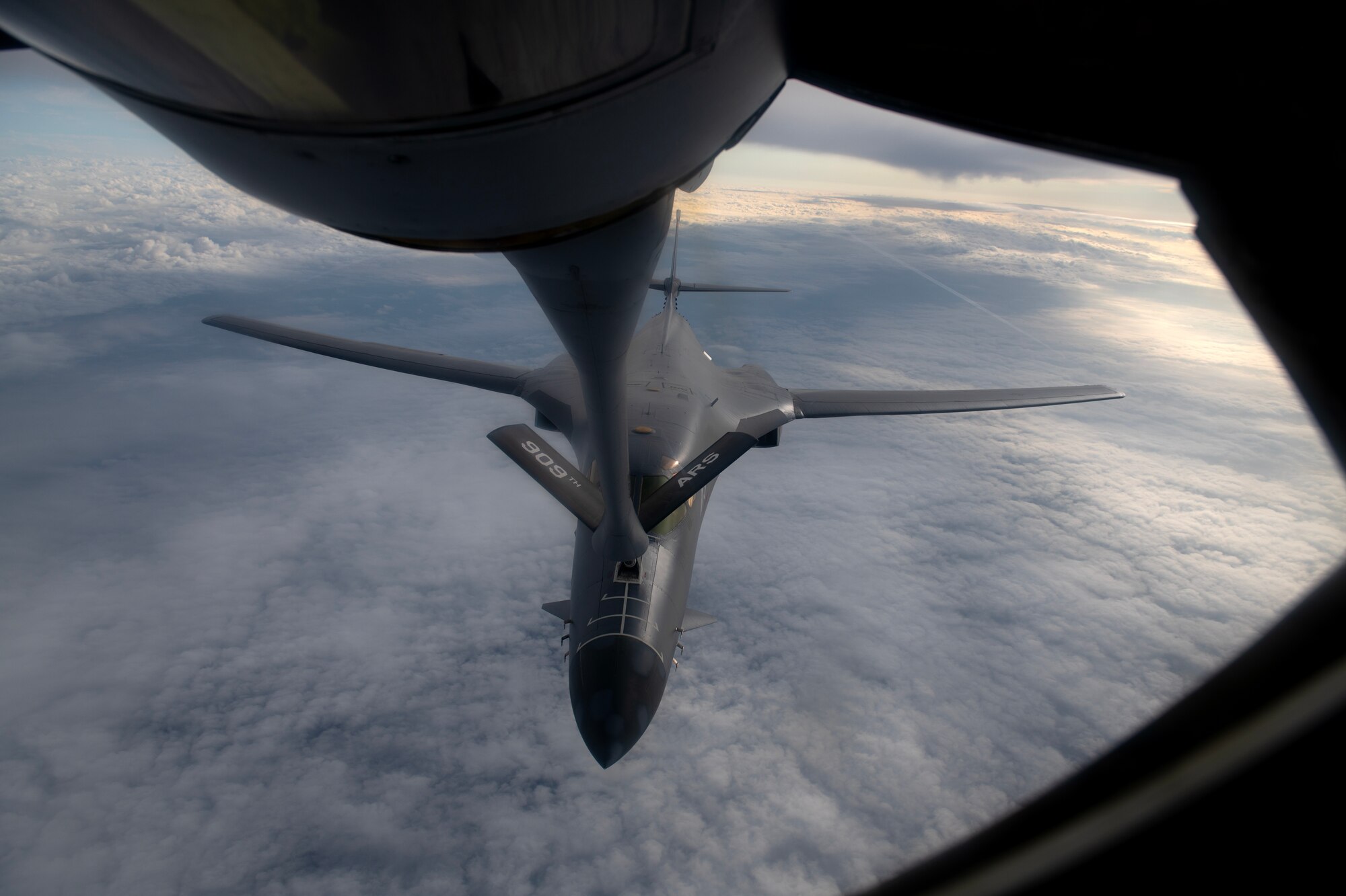 A U.S. Air Force 34th Expeditionary Bomb Squadron B-1B Lancer receives fuel from a 909th Air Refueling Squadron KC-135 Stratotanker during a flight over the Pacific Ocean, March 19, 2023. Aerial missions support sustained regional stability in the Indo-Pacific by demonstrating the U.S. Air Force’s ability to deter aggression in support of Allied and partner nations. (U.S. Air Force photo by Senior Airman Jessi Roth)