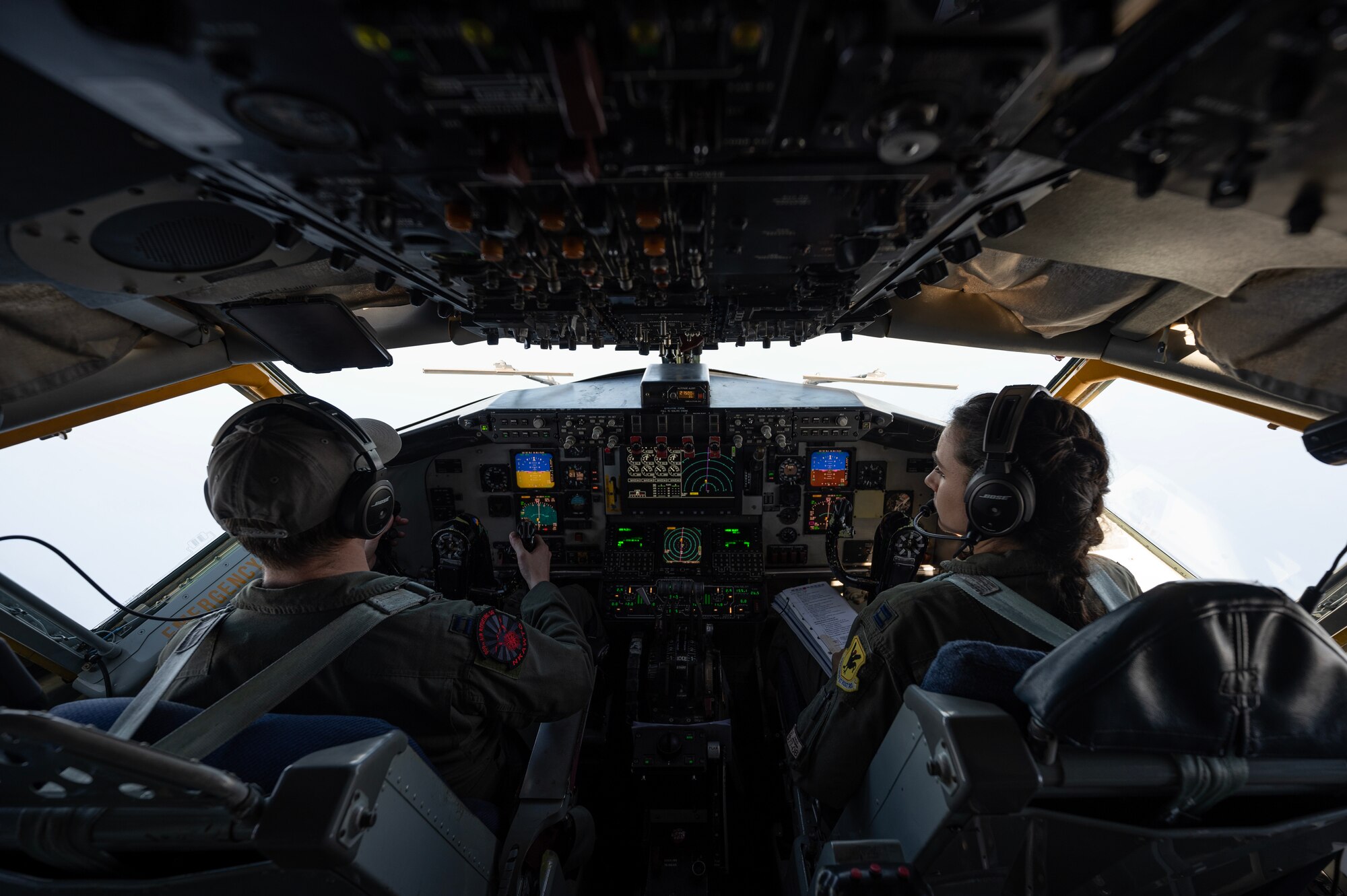 U.S. Air Force Capt. Steven Lau, left, and Capt. Jessica Wallander, 909th Air Refueling Squadron KC-135 Stratotanker pilots, fly over the Pacific Ocean during a refueling mission, March 19, 2023. Aerial refueling capabilities extend airborne training time and combat radius, ensuring U.S. and allied nation aircraft are postured to maintain regional peace and stability within the Indo-Pacific area of responsibility. (U.S. Air Force photo by Senior Airman Jessi Roth)