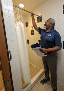 Checks a shower curtain rod