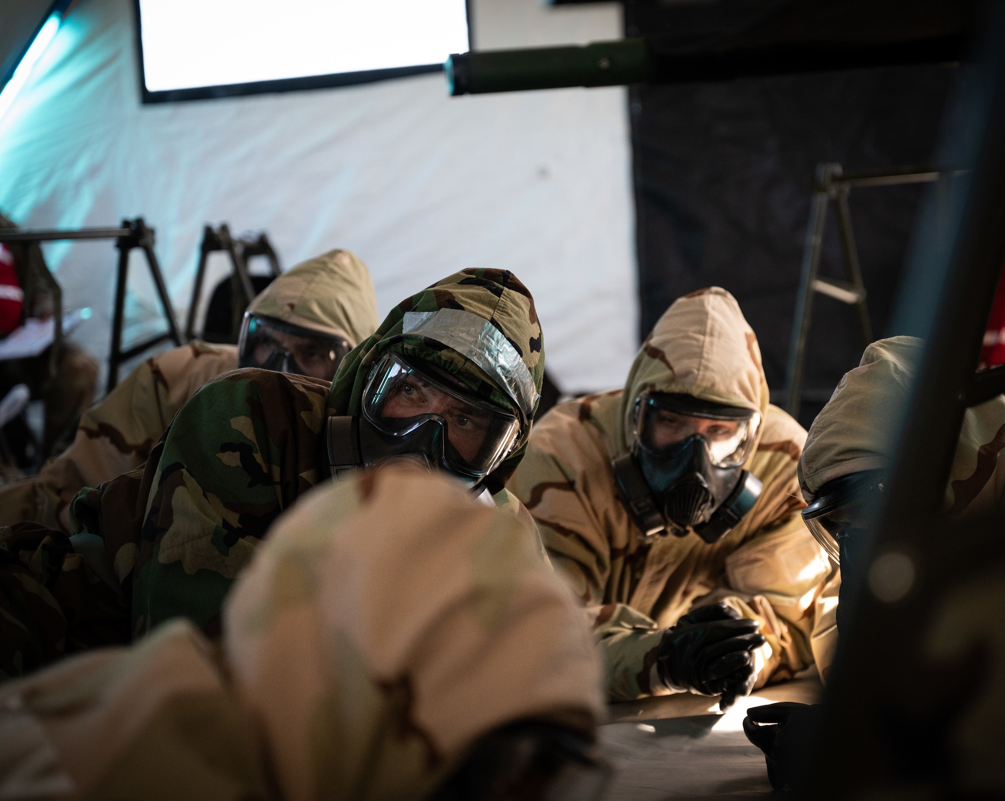 927th Aeromedical Staging Squadron Airmen don mission oriented protective posture gear during a simulated attack in an exercise on MacDill Air Force Base, Fla., Feb 8, 2023. The exercise allowed Airmen to hone fundamental skills such as chemical, biological, radiological and nuclear response, increasing full-spectrum readiness. (U.S. Air Force photo by Tech. Sgt. Bradley Tipton)
