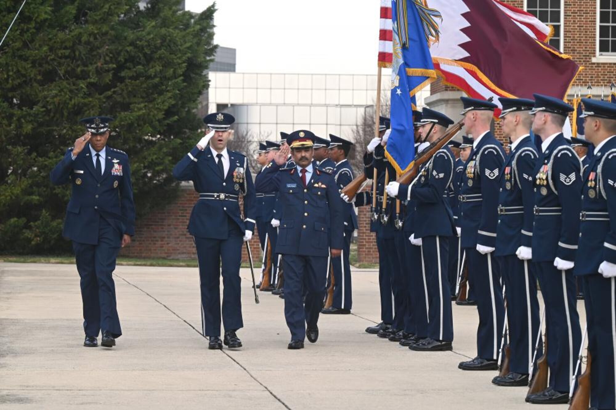 Air Force Chief of Staff Gen. CQ Brown, Jr. and Qatar Emiri Air Force Commander Maj. Gen. Jassim Al-Mannai inspect the Honor Guard during a welcome ceremony at Joint Base Anacostia-Bolling, Washington, D.C., March 16, 2023. The visit furthered the strong U.S.-Qatar partnership. (U.S. Air Force photo by Andy Morataya)