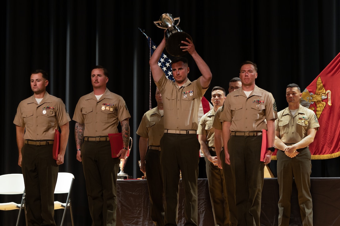 U.S. Marines with Infantry Training Battalion East are awarded the Wirgman Trophy at the 2023 Marine Corps Marksmanship Competition East Ceremony at the Base Theater on Marine Corps Base Camp Lejeune, North Carolina, March 17,2023.   The Wirgman Trophy is given to the winners of the rifle team match that belong to a unit of less than or equal to 559 personnel at max strength.  (U.S. Marine Corps photo by Cpl. Zeta Johnson)