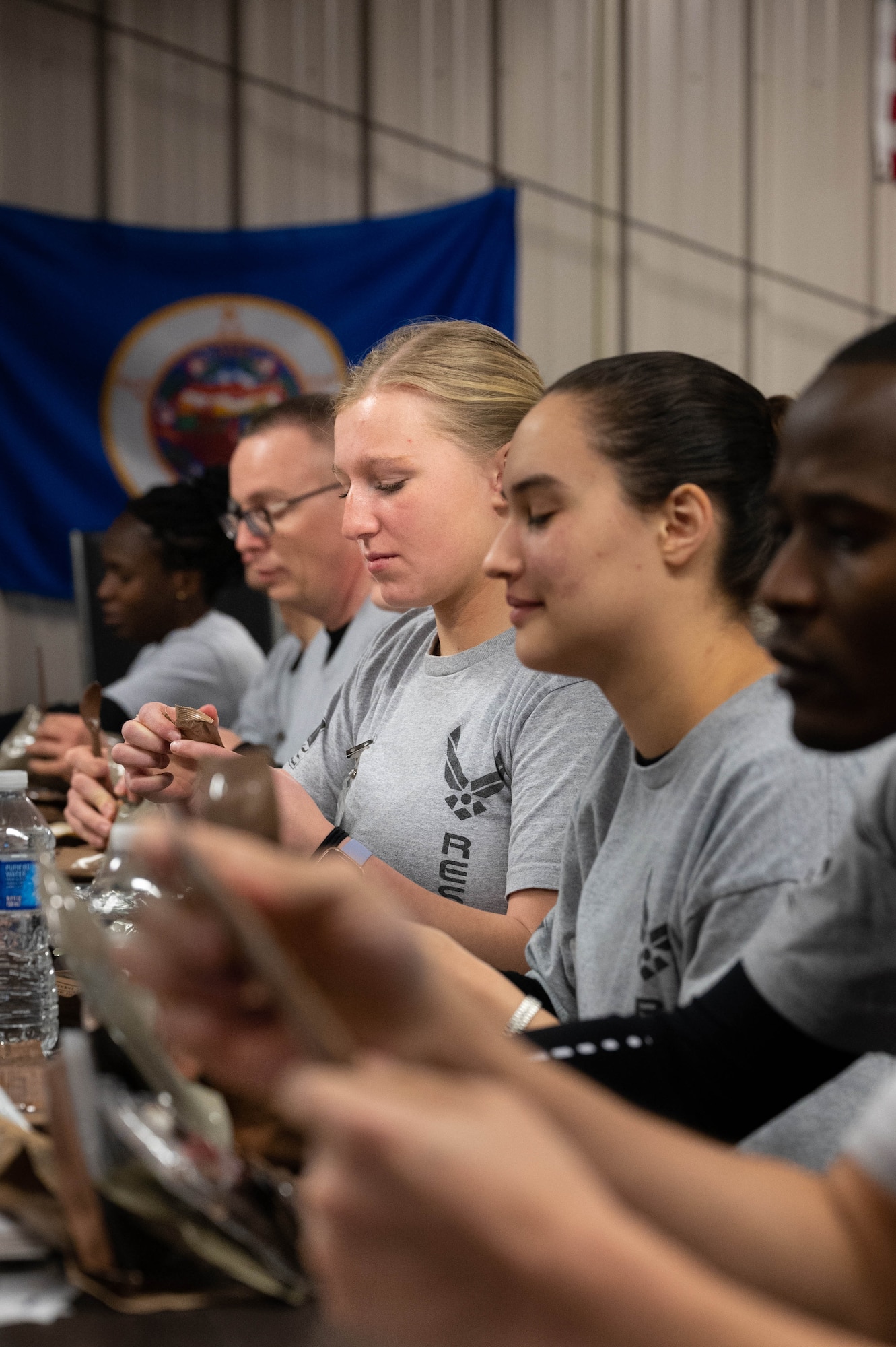 Trainee Keevan Jones, 934th Airlift Wing Development and Training Flight trainee, examines a component of a meal meady-to-eat at the D&TF building at the Minneapolis-St. Paul Air Reserve Station, Minnesota, March 5, 2023. Jones said she liked the quantity and taste of the MRE and felt prepared to eat them for several days during Basic Military Training. (U.S. Air Force photo by Senior Airman Victoriya Tarakanova)