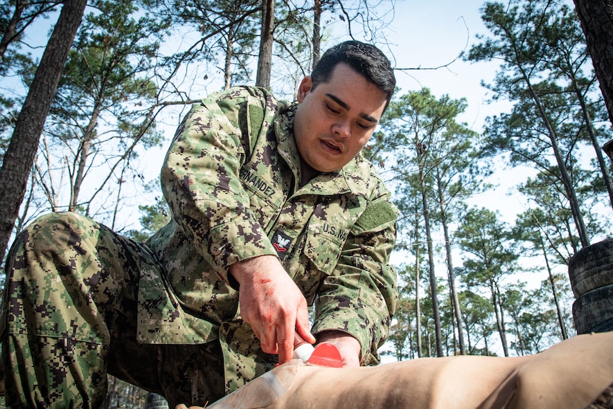 *Training* Hospital Corpsman Second Class Angel Hernandez treats his assigned casualty, a mannequin, while conducting Tactical Combat Casualty Care on March 17 aboard Marine Corps Air Station Cherry Point.  The training includes two days of classroom instruction and culminates in a practical exercise involving mannequins equipped to simulate battlefield casualties.