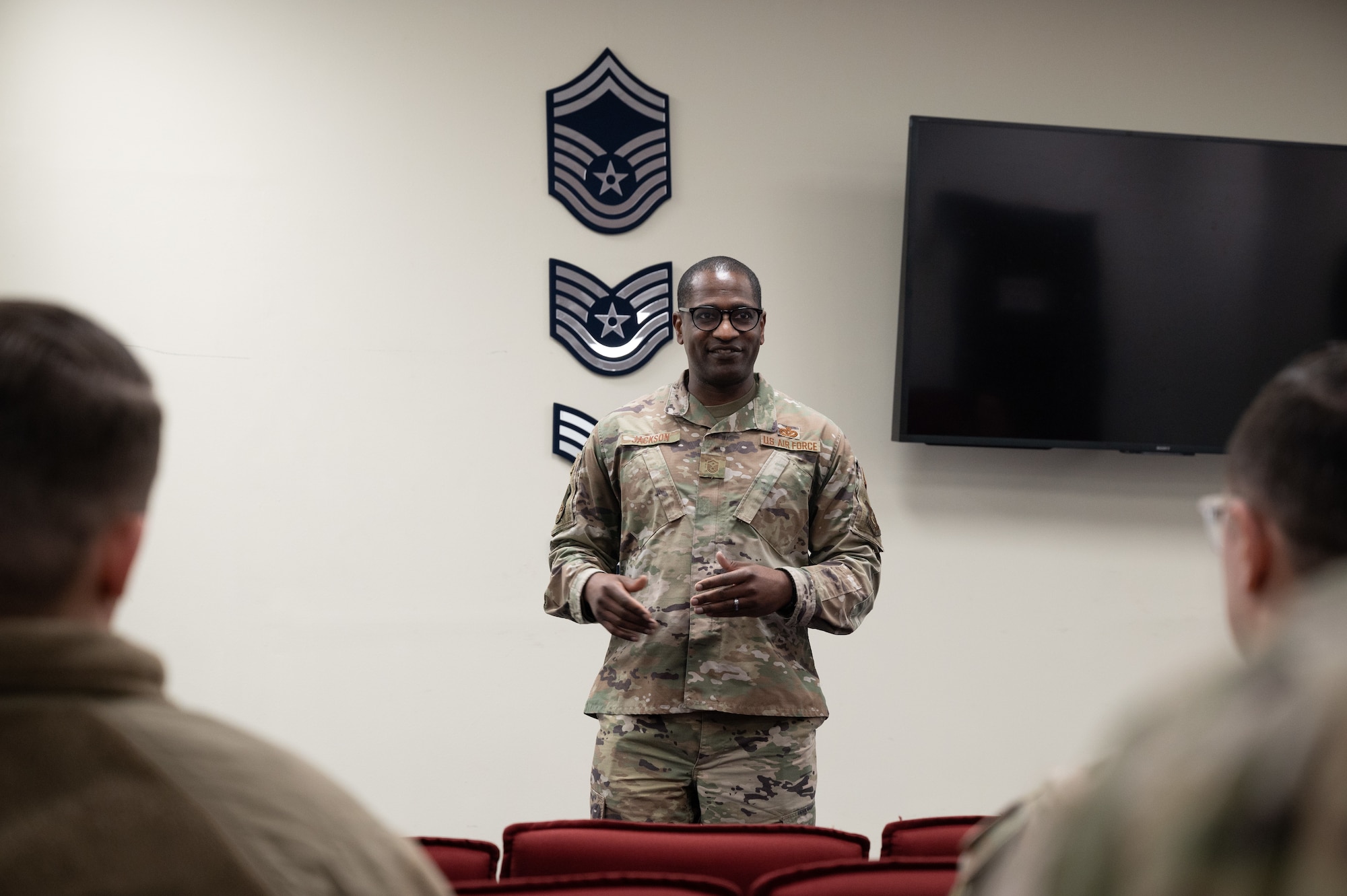 Master Sgt. Cedric Jackson, 8th Maintenance Group first sergeant, speaks to Airmen at the Professional Enhancement Center at Kunsan Air Base, Republic of Korea, Mar. 16, 2023. Several leaders came to congratulate Airmen on earning college credits through taking College-Level Examination Program tests during a “CLEP-a-thon” event hosted by the Professional Development Center. (U.S. Air Force photo by Staff Sgt. Sadie Colbert)