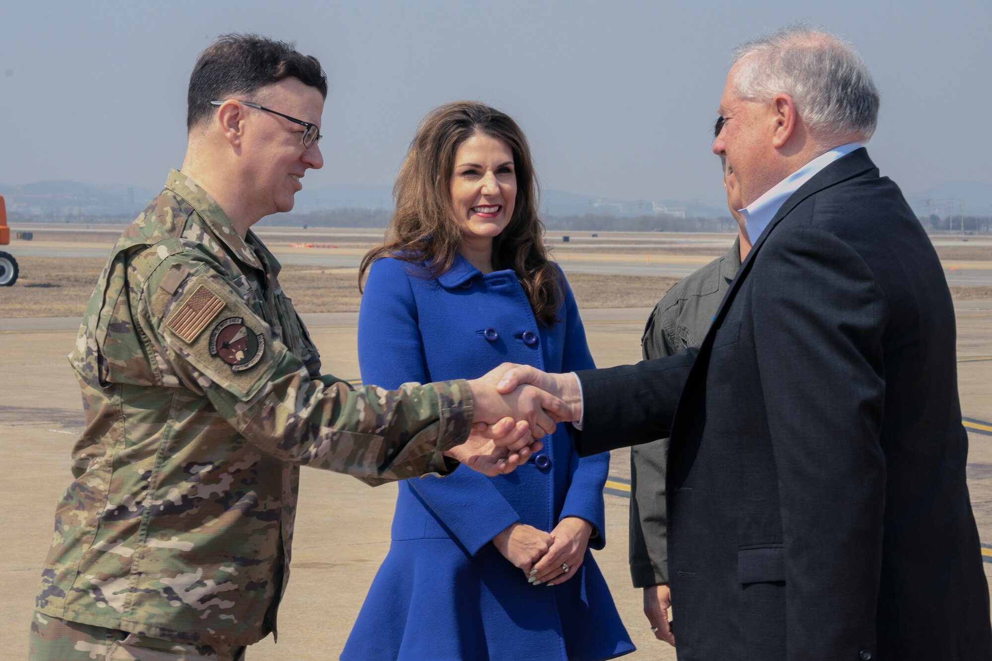 U.S. Air Force Chief Master Sgt. David Weaver, 51st Fighter Wing interim command chief, shakes hands with Secretary of the Air Force Frank Kendall at Osan Air Base, Republic of Korea, March 19, 2023.